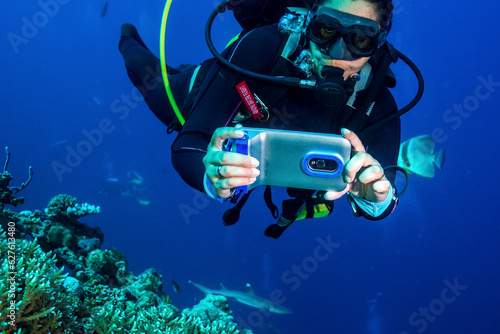 Scuba Diver with iPhone Underwater Housing © feel4nature