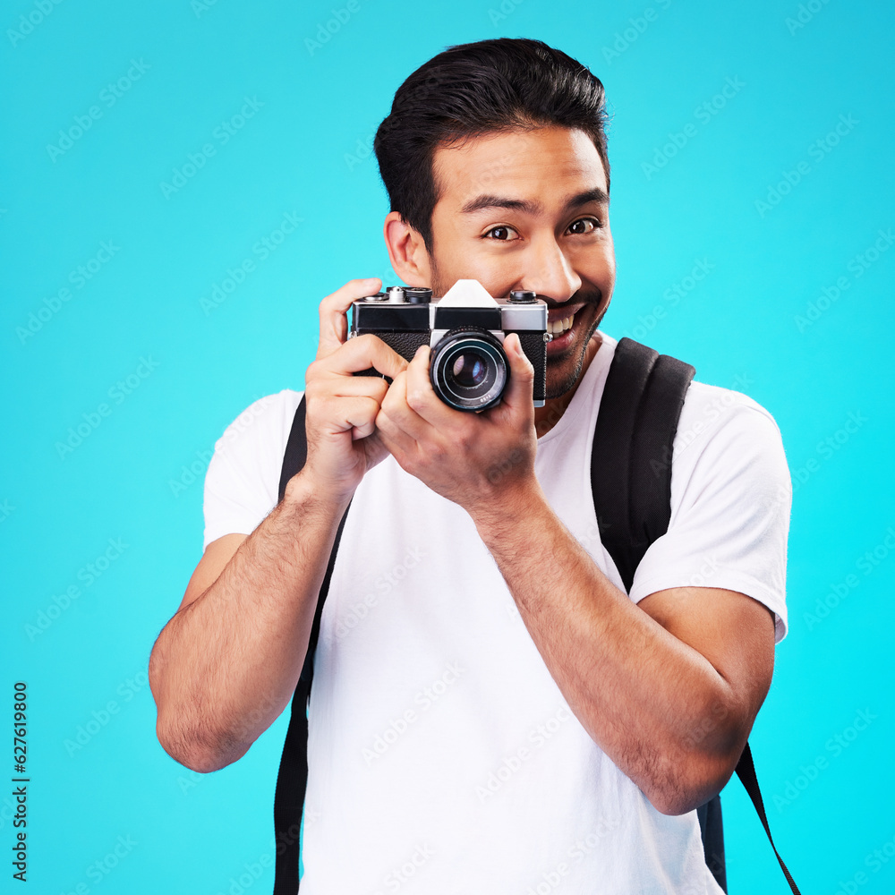 Portrait, creativity and man with a camera, photography and artist against a blue studio background. Face, male person and model with vintage technology, journalist and photographer with inspiration Portrait, creativity and man with a camera, photography and artist against a blue studio background. Face, male person and model with vintage technology, journalist and photographer with inspiration