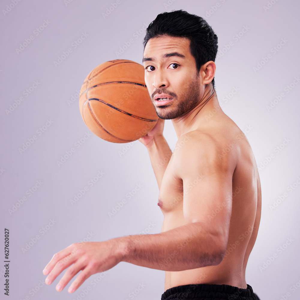 Portrait, playing basketball and a sports man in studio on a gray background for training or a game. Exercise, workout or mindset and a young male athlete holding a ball to play a competitive match Portrait, playing basketball and a sports man in studio on a gray background for training or a game. Exercise, workout or mindset and a young male athlete holding a ball to play a competitive match