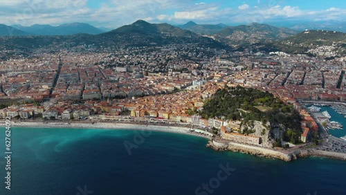Aerial view of Nice City Promenade Beach and Mediterranean Sea in Cote d'Azur, France. Seaside luxury resort town on the French Riviera with turquoise sea and beautiful panoramic city landscape 4K
