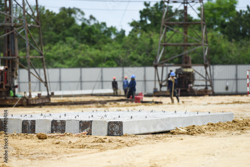 concrete pole with derrick on duty in construction site