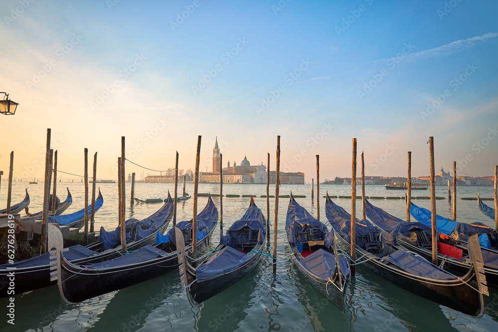 Sunrise in the Floating City: Gondolas Waiting in the Venetian Lagoon