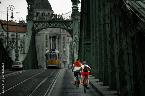 Photography Trafic in Budapest. Cyclists on the historic bridge in Budapest.