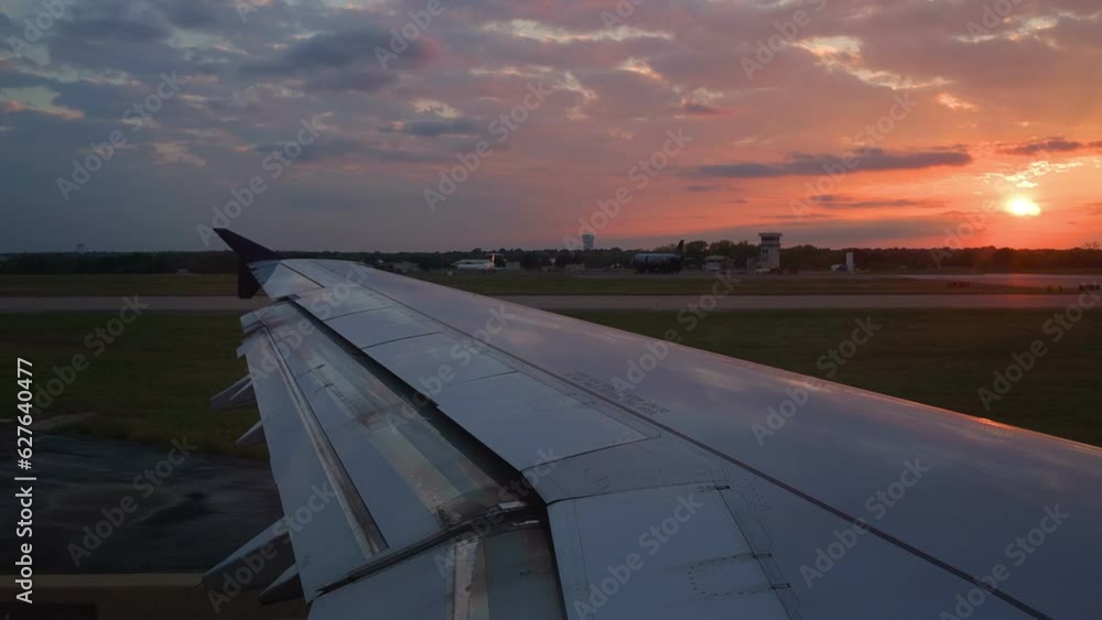 Plane is preparing to take off with the sunset in the background Plane is preparing to take off with the sunset in the background