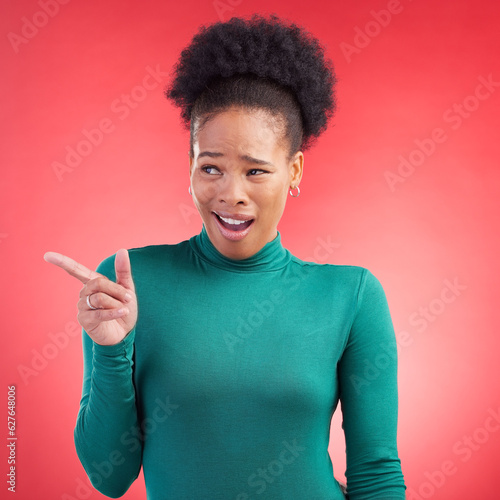 Canvas Print Pointing, confused and a black woman on a red background for showing, angry or frustrated