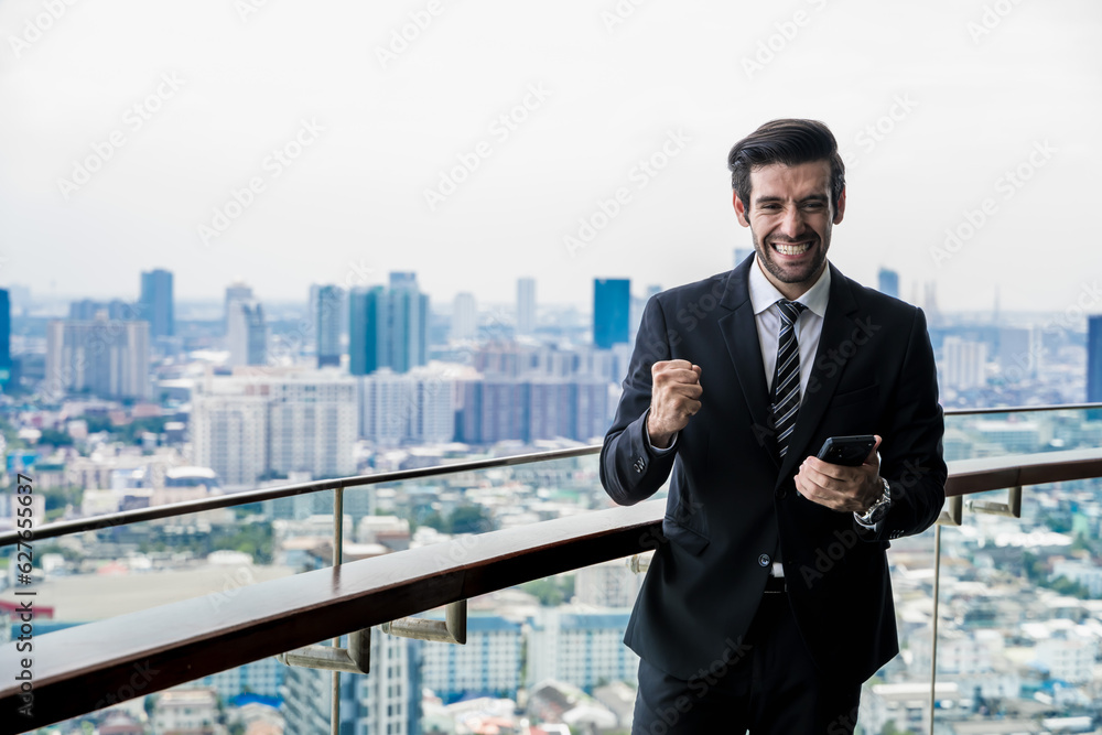 Smiling Indian businessman feeling glad with successful business at room balcony with cityscape background, Rooftop business portrait Smiling Indian businessman feeling glad with successful business at room balcony with cityscape background, Rooftop business portrait