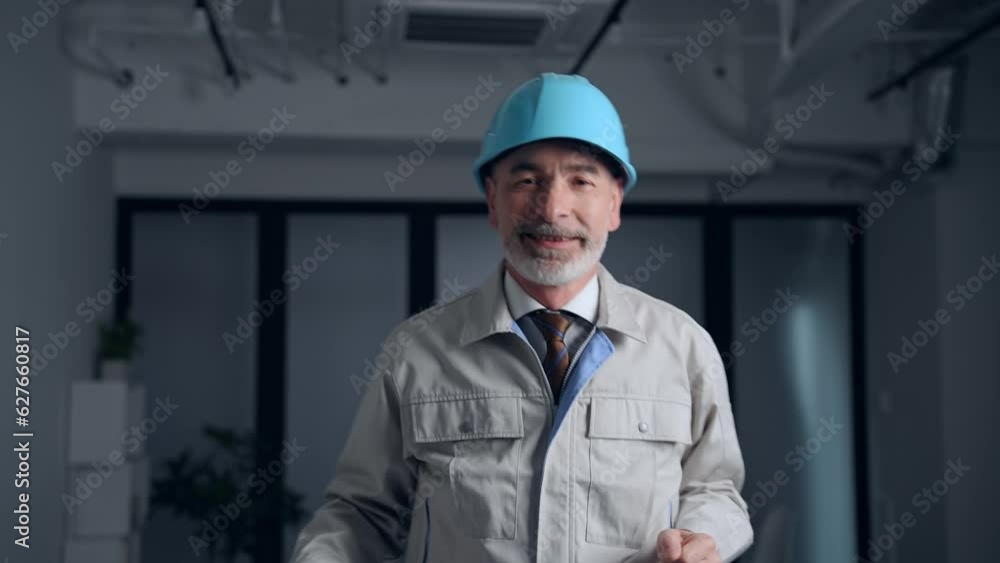 Dancing middle-aged white engineer in a working wear. Dancing middle-aged white engineer in a working wear.