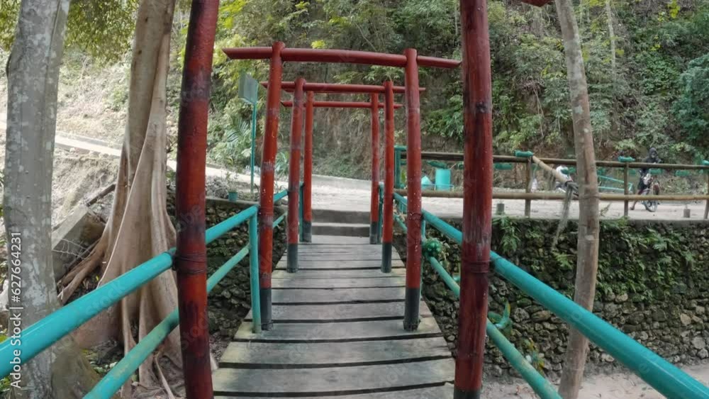 Bamboo frame shrine across a bridge in the Philippine jungle Bamboo frame shrine across a bridge in the Philippine jungle