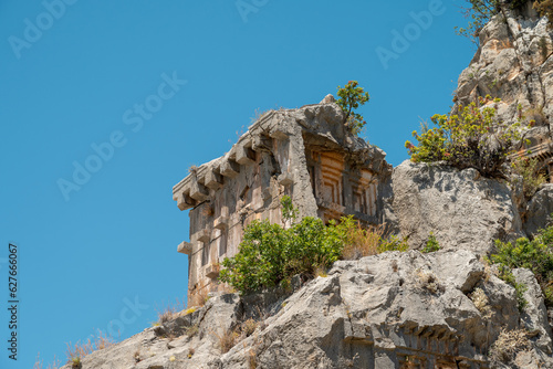 The ruins of the amphitheater and ancient rock tombs in the ancient city of Myra in Demre, Turkey