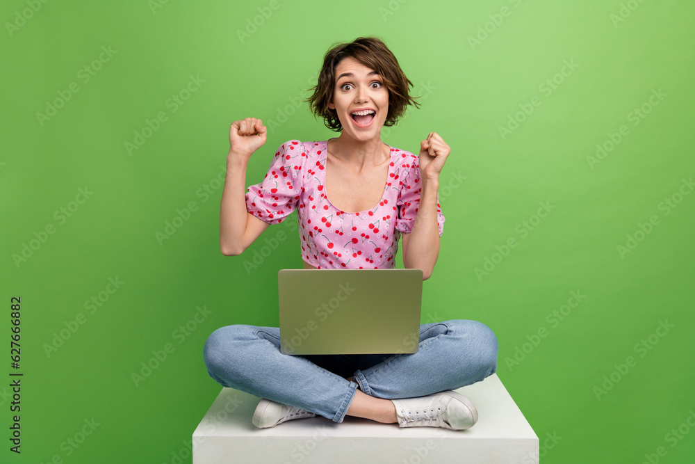 Full length photo of shiny lucky girl dressed print top online shopping sale modern gadget isolated green color background Full length photo of shiny lucky girl dressed print top online shopping sale modern gadget isolated green color background