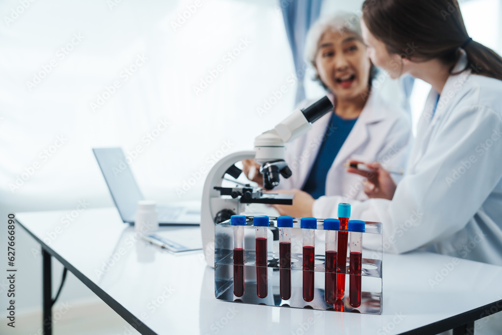 Health care researchers working in life science laboratory, Teaching in labs - Requiring students to record their laboratory methods and results as a running record of their laboratory work. Health care researchers working in life science laboratory, Teaching in labs - Requiring students to record their laboratory methods and results as a running record of their laboratory work.
