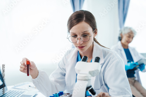 Health care researchers working in life science laboratory  Teaching in labs - Requiring students to record their laboratory methods and results as a running record of their laboratory work.