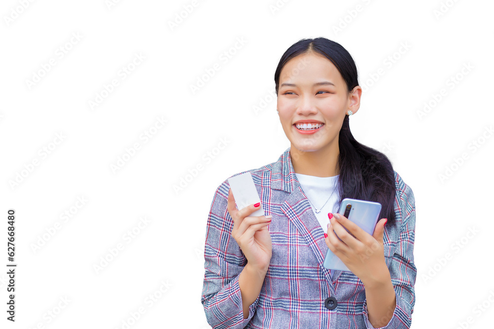 Professional Asian woman in brown striped blazer smiles happily successful and confident while holds smartphone and credit card among while isolated on white background Professional Asian woman in brown striped blazer smiles happily successful and confident while holds smartphone and credit card among while isolated on white background