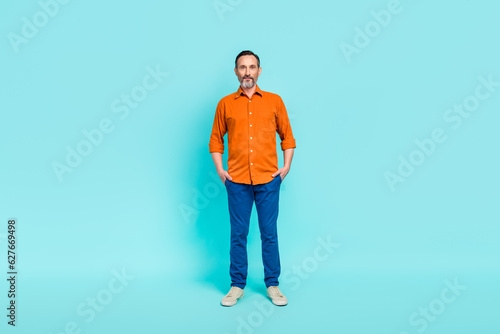 Full body size photo cadre of confident businessman put hands pockets entrepreneur ceo company chief boss isolated on blue color background