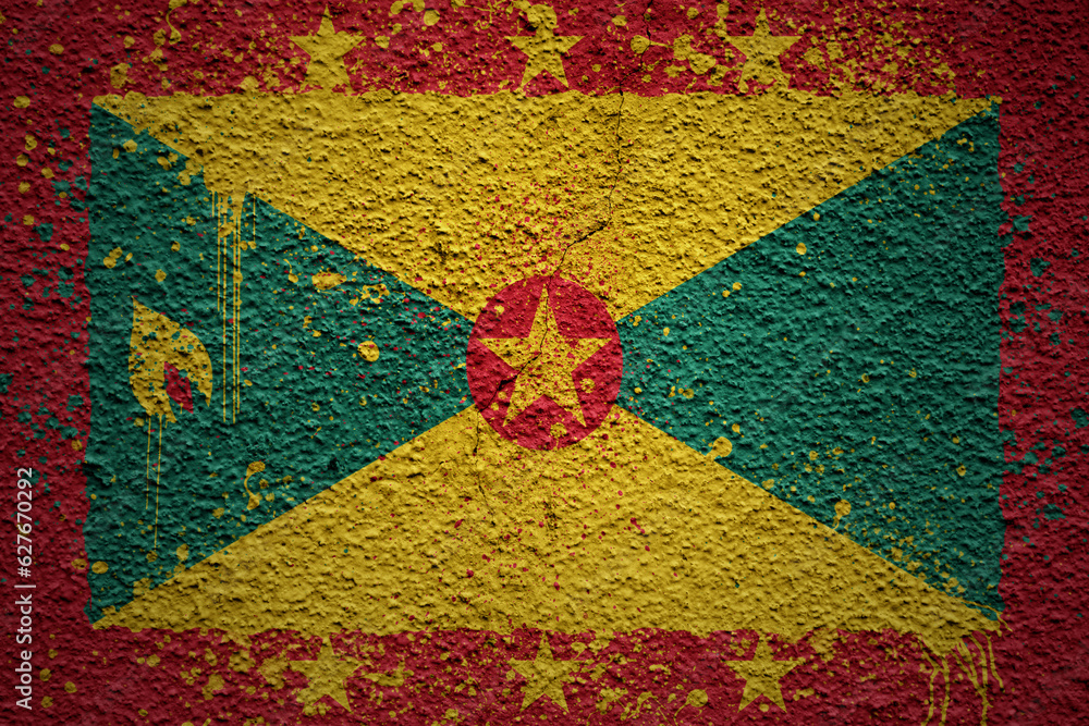 painted big national flag of grenada on a massive old cracked wall