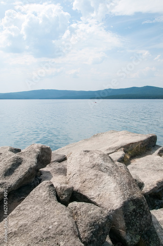 Turgoyak lake in summer with huge boulders in the foreground  South Ural  Russia