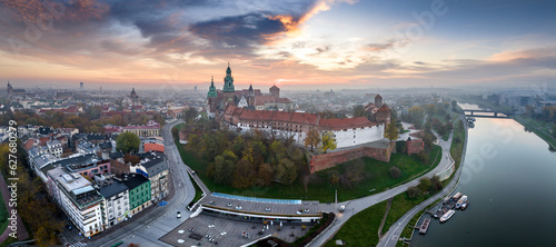 Aerial panorama of Cracow skyline, including Wawel Castle and Vistula river at sunrise in Autumn.