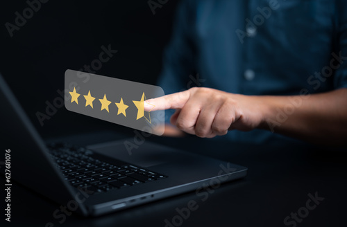 Customer feedback satisfaction survey concept. Customers use laptop and point happy smiley icon. Satisfied, 5 Stars, Service experience rating. Online complacency Review application, Checking quality.