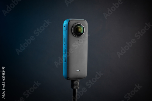 Modern 360 degree digital camera on black background
