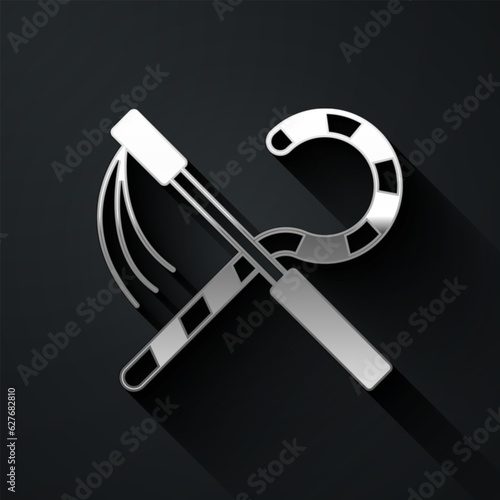 Silver Crook and flail icon isolated on black background. Ancient Egypt symbol. Scepters of egypt. Long shadow style. Vector