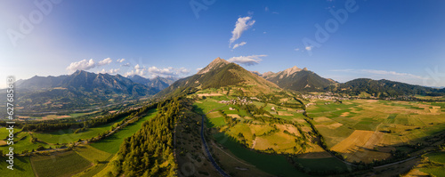 Fototapeta Naklejka Na Ścianę i Meble -  Panoramic aerial view of villages of Les Faix (center), Ancelle (right) and Saint-Leger-les-Melezes (left). Summer in Champsaur Valley, Hautes Alpes (Alps), France