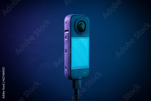 Modern 360 degree digital camera on black background