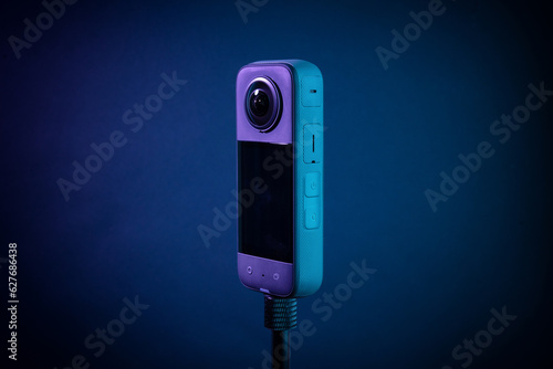 Modern 360 degree digital camera on black background