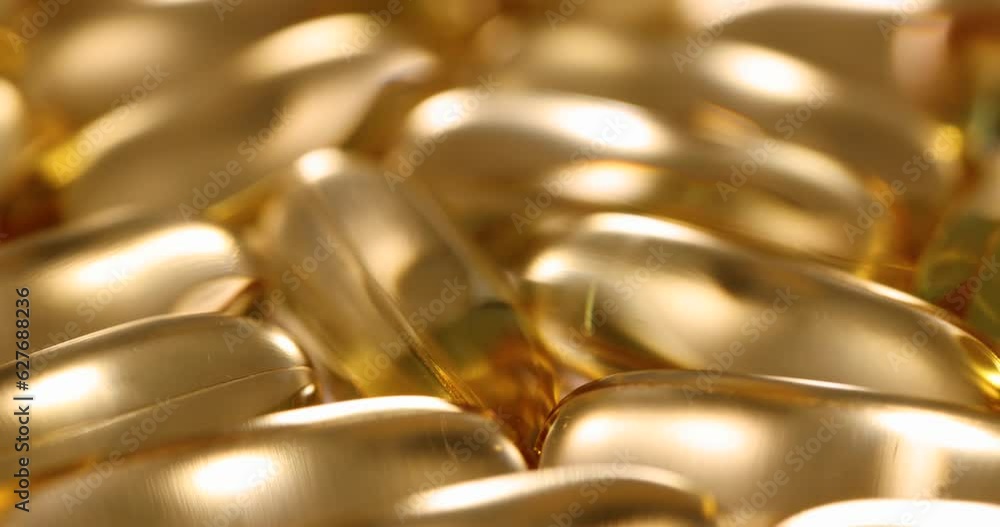 Multiple yellow fish oil gelatin capsules 4k movie. Dietary supplements concept Multiple yellow fish oil gelatin capsules 4k movie. Dietary supplements concept