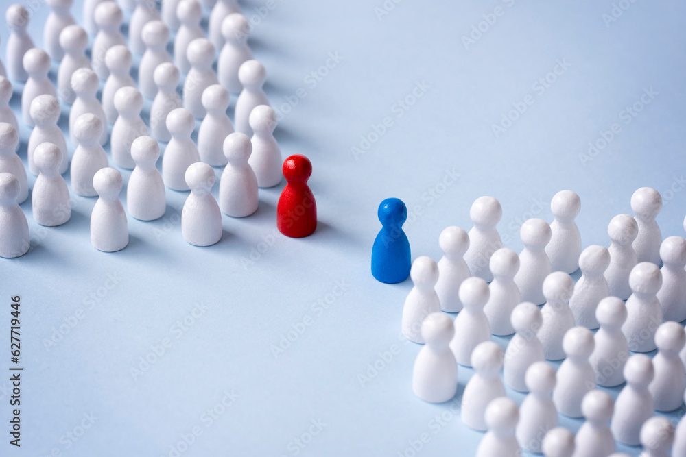 Conceptual confrontation still life with minimal style figurine.