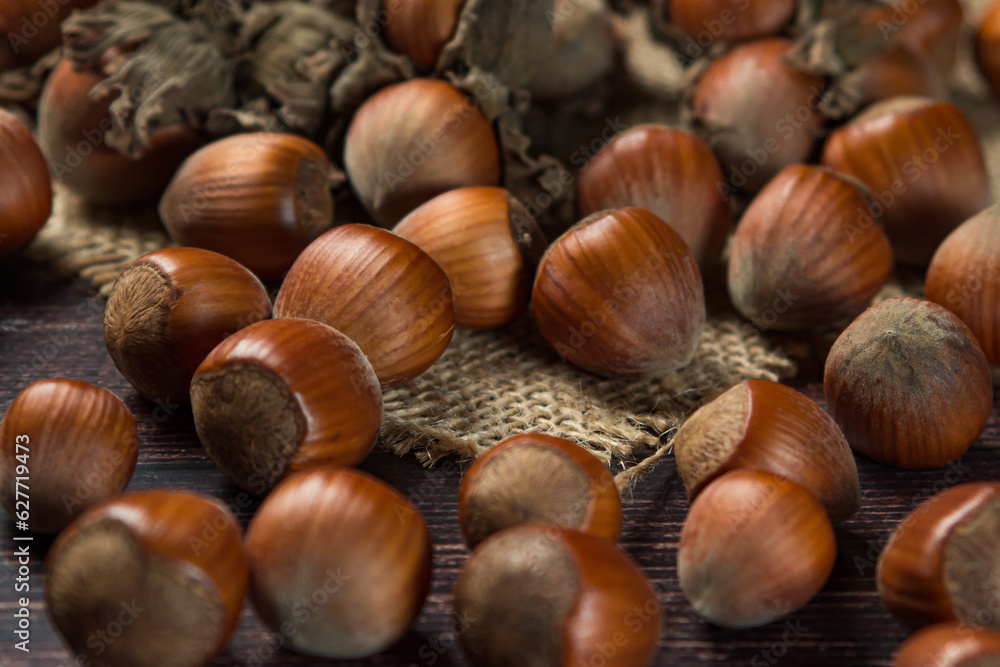 Hazelnuts on a wooden table. Hazelnut in shell Hazelnuts on a wooden table. Hazelnut in shell