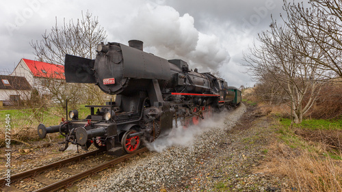 Historic steam train pulling several carriages