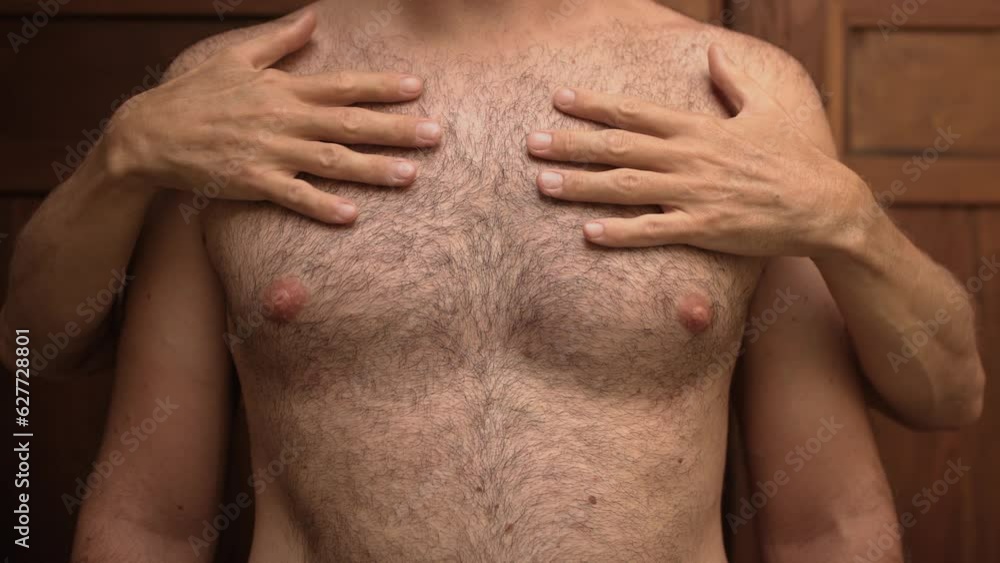 Close-up of a naked hairy man's body, which is touched by the male hands of another unrecognizable man 4K Close-up of a naked hairy man's body, which is touched by the male hands of another unrecognizable man 4K