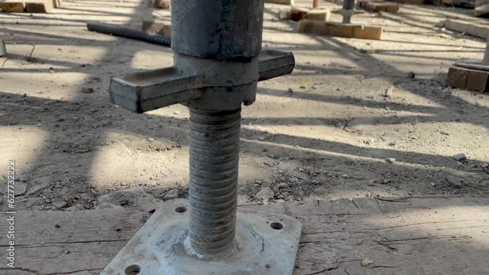 Jack base supports scaffolding in construction site closeup Jack base supports scaffolding in construction site closeup