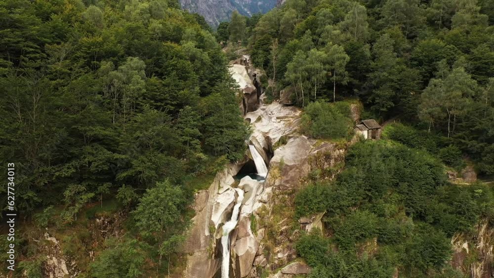 Aerial view of an incredible steep waterfall surrounded by the lush vegetation of the forest Aerial view of an incredible steep waterfall surrounded by the lush vegetation of the forest