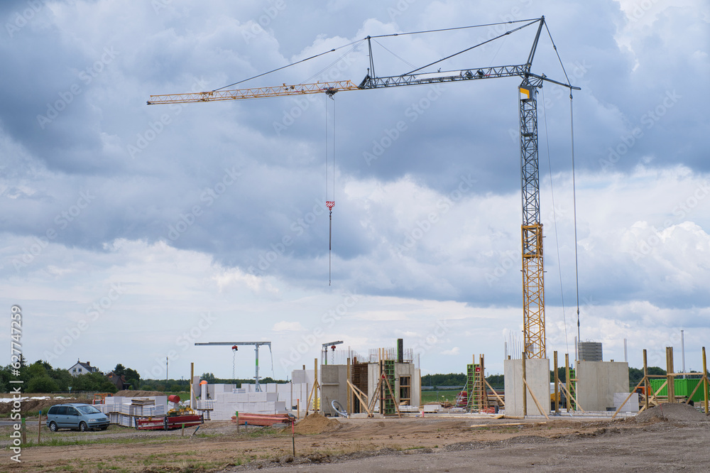 initial phase of a house construction, construction site with crane