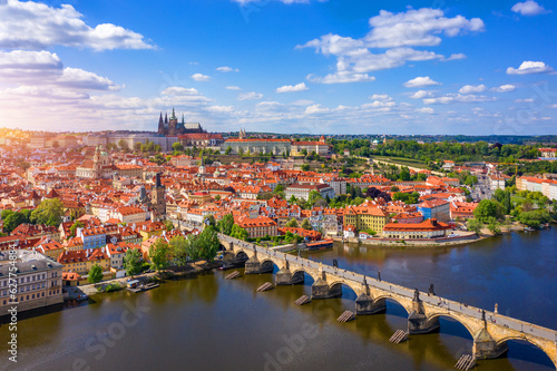 Scenic view of the Old Town pier architecture and Charles Bridge over Vltava river in Prague, Czech Republic. Prague iconic Charles Bridge (Karluv Most) and Old Town Bridge Tower at sunset, Czechia.
