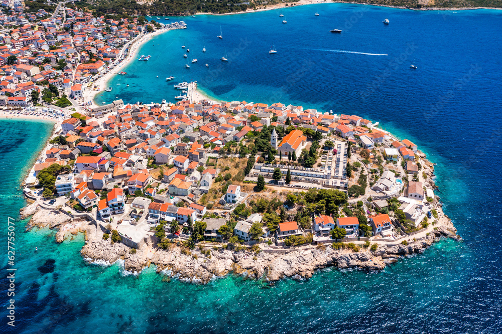Aerial view of Primosten old town on the islet, Dalmatia, Croatia. Primosten, Sibenik Knin County, Croatia. Resort town on the Adriatic coast. Aerial view of adriatic town Primosten, Croatia