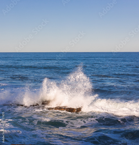 Wave breaking over rock La Jolla San Diego California