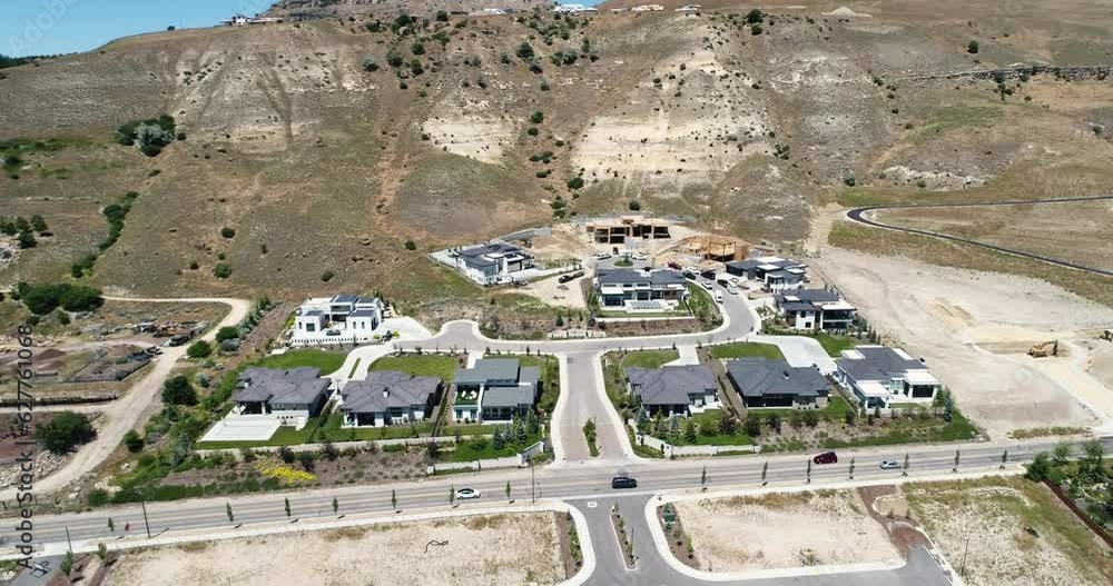 Aerial 4k view of a new custom home construction site next to foothills in Boise, Idaho Aerial 4k view of a new custom home construction site next to foothills in Boise, Idaho