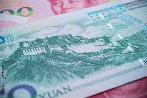 Potala palace, Tibet in back side of 50 Chinese paper currency Yuan renminbi banknotes background. China or economy of Asia growth, financial business, US trade war, Forex trading concept. photo