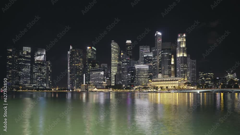 The view of the Singapore river with skyscrapers in the background The view of the Singapore river with skyscrapers in the background