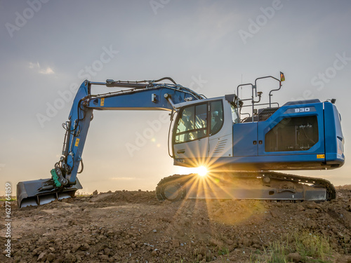 Excavator with sundawn photo