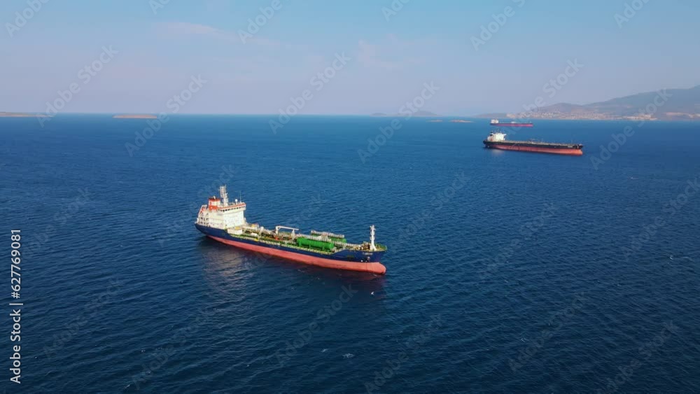 Oil chemical tanker anchored in sea, waiting loading in commercial port. Global trading Oil chemical tanker anchored in sea, waiting loading in commercial port. Global trading