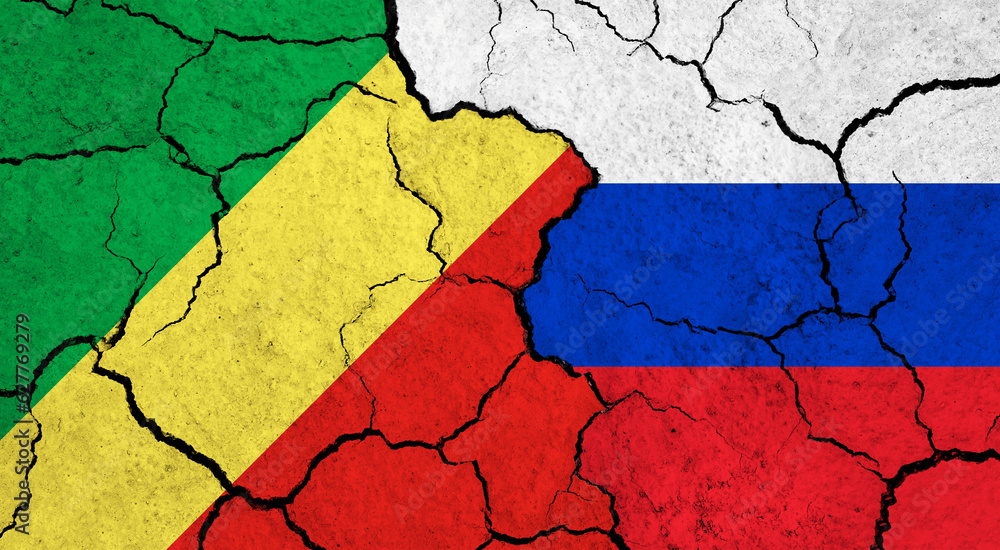Flags of Congo and Russia on cracked surface - politics, relationship concept Flags of Congo and Russia on cracked surface - politics, relationship concept