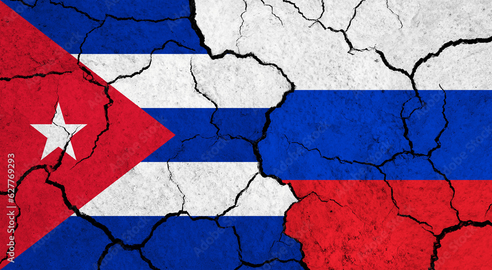 Flags of Cuba and Russia on cracked surface - politics, relationship concept