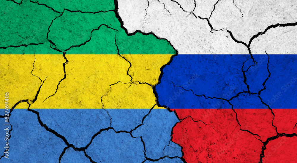 Flags of Gabon and Russia on cracked surface - politics, relationship concept