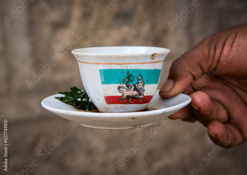 Cup of ethiopian coffee with lion of judah on it, Oromia, Metehara, Ethiopia photo