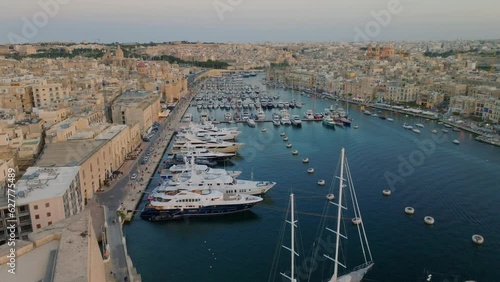 Aerial drone sunset view of marina and yachts in Birgu city. Malta photo