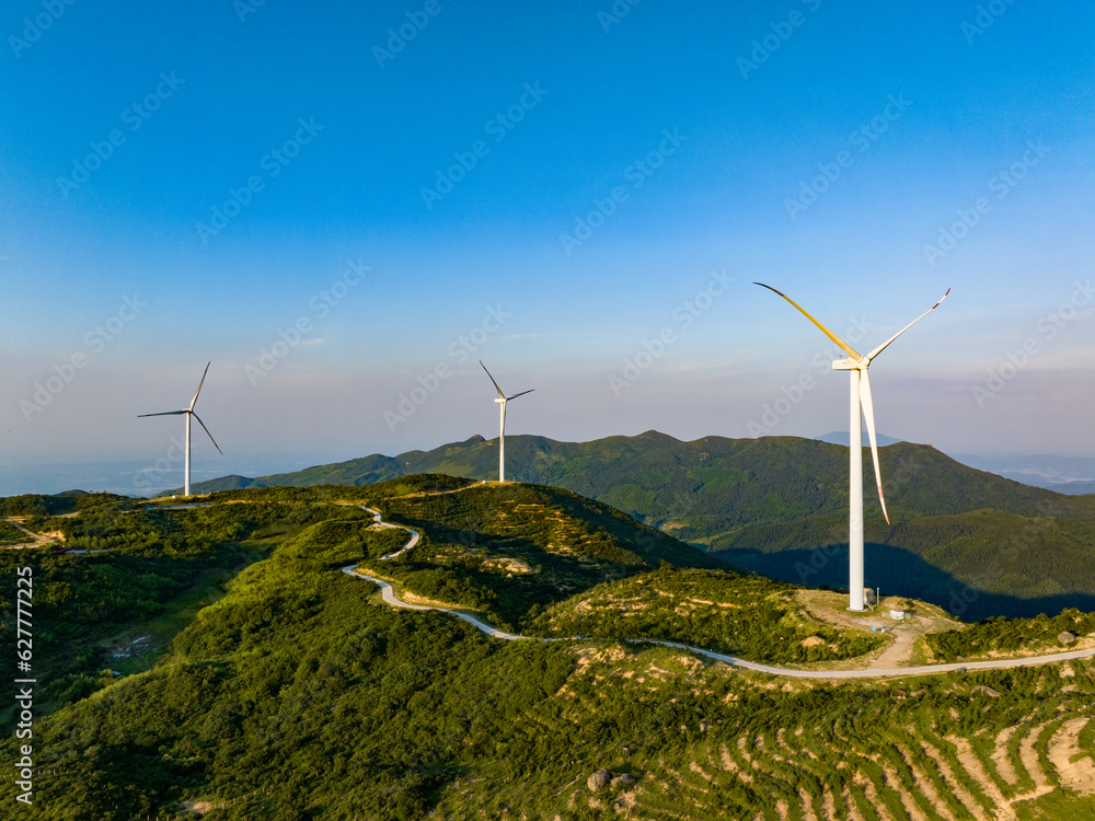 Wind farm on the mountain, blue sky and white clouds Wind farm on the mountain, blue sky and white clouds