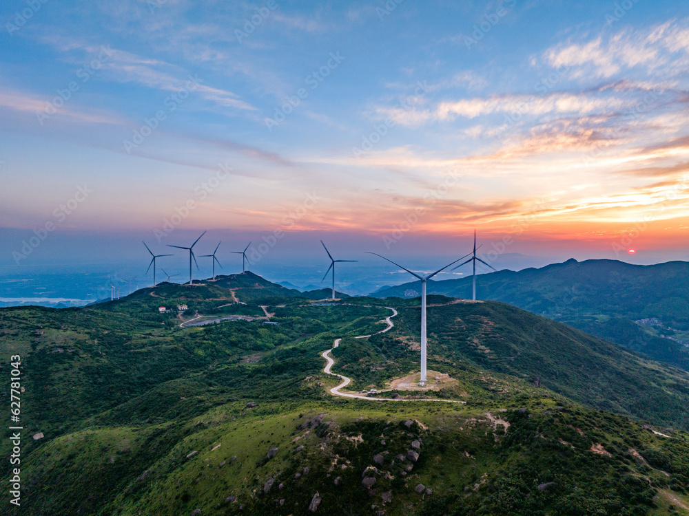 Beautiful sunrise and wind power in the mountains